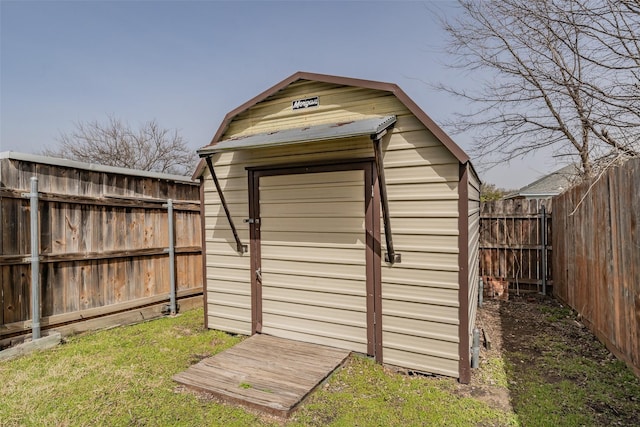 view of shed with a fenced backyard