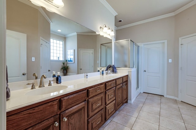 bathroom with a sink, a stall shower, crown molding, and tile patterned flooring