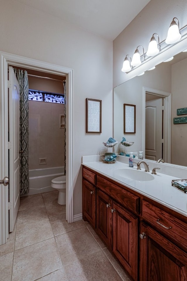 bathroom with tile patterned flooring, toilet, vanity, and shower / bath combo with shower curtain