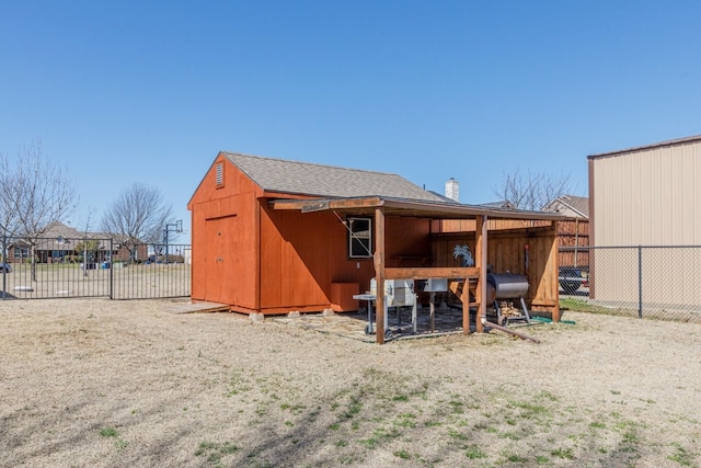 view of outbuilding featuring an outbuilding and fence