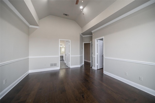 spare room with wood finished floors, visible vents, and baseboards