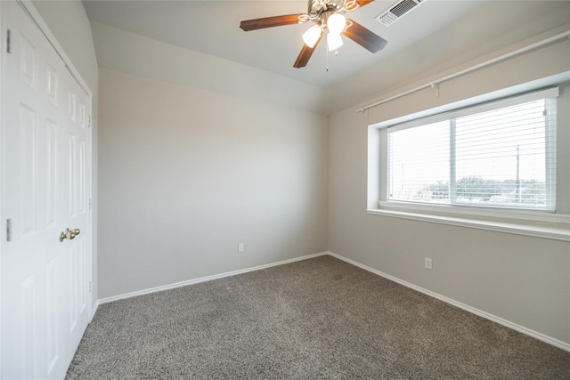 unfurnished bedroom featuring carpet, visible vents, a closet, and baseboards