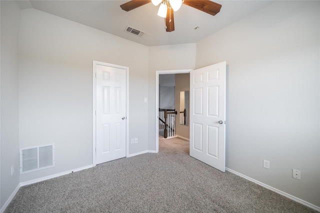 unfurnished bedroom featuring visible vents, ceiling fan, baseboards, and carpet