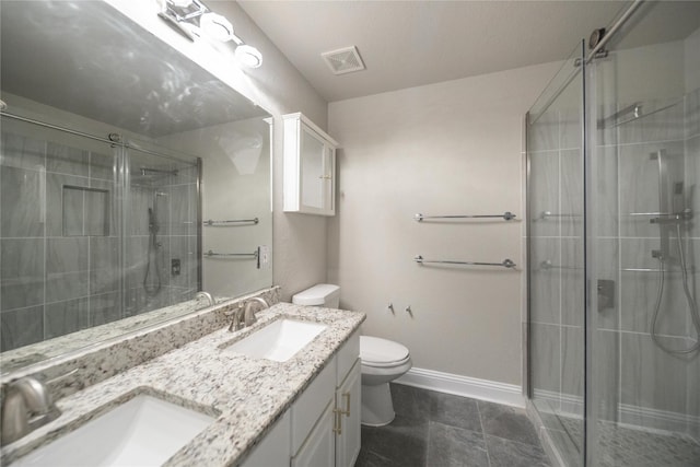 bathroom with visible vents, a stall shower, toilet, and a sink