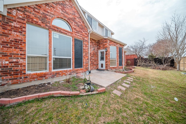 exterior space featuring a patio area and a fenced backyard