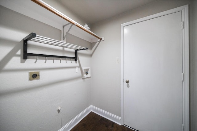 laundry room featuring hookup for a washing machine, baseboards, laundry area, electric dryer hookup, and dark wood-type flooring