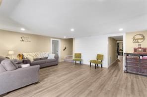 living room with recessed lighting and wood finished floors