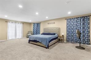 carpeted bedroom featuring recessed lighting