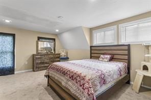 bedroom with lofted ceiling, recessed lighting, carpet, and baseboards