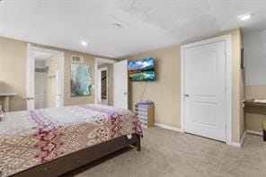 carpeted bedroom with baseboards