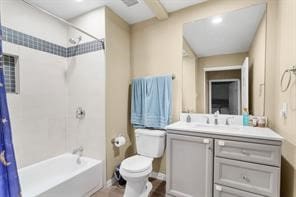 bathroom featuring vanity, toilet, and shower / tub combo