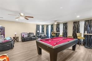 playroom with plenty of natural light, pool table, ceiling fan, and wood finished floors