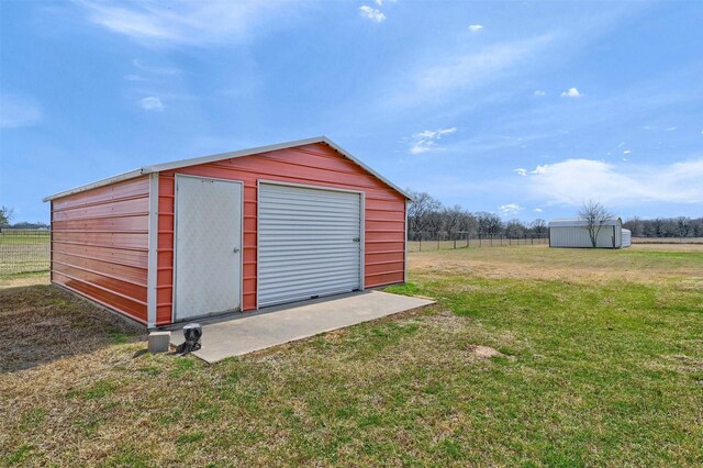 view of outdoor structure with an outdoor structure and fence