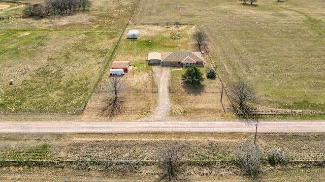 birds eye view of property with a rural view