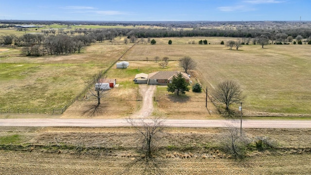 birds eye view of property with a rural view