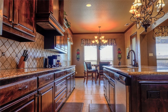 kitchen with stainless steel dishwasher, ornamental molding, visible vents, and a chandelier