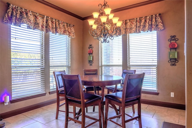 dining room featuring crown molding, light tile patterned floors, baseboards, and a chandelier