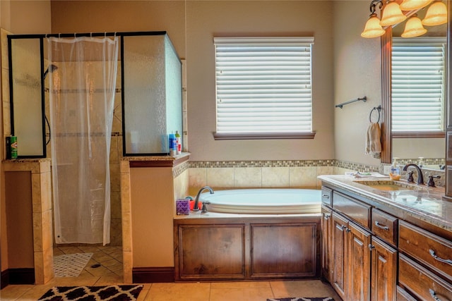 full bathroom with a tile shower, tile patterned flooring, plenty of natural light, and a garden tub