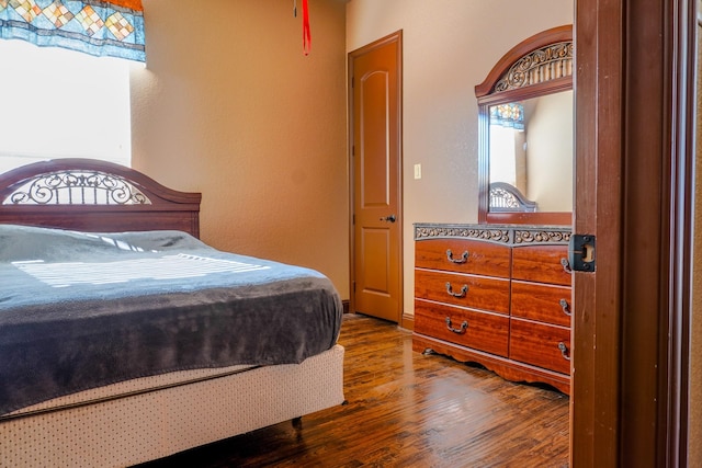 bedroom featuring wood finished floors