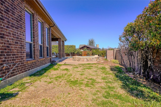 view of yard with a patio and a fenced backyard