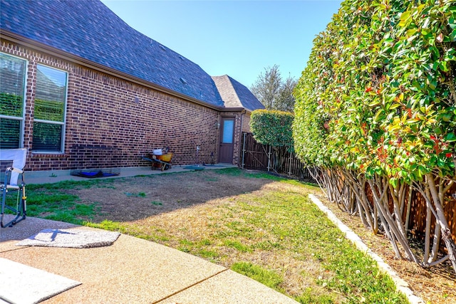 view of yard with a patio area and fence