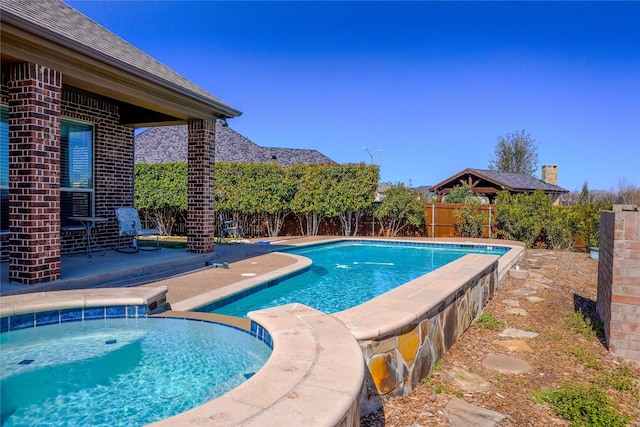 view of swimming pool featuring a patio area, a fenced backyard, and a fenced in pool