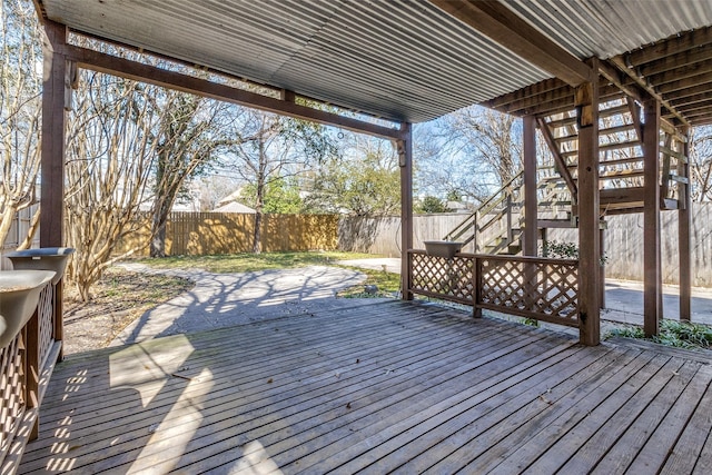 wooden terrace featuring stairway and a fenced backyard