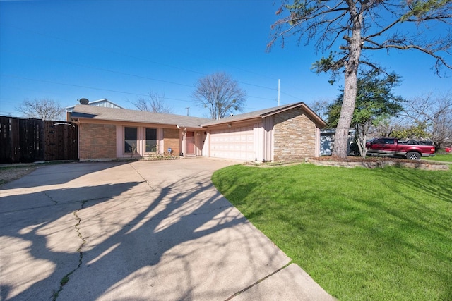 ranch-style home with brick siding, a front lawn, fence, a garage, and driveway