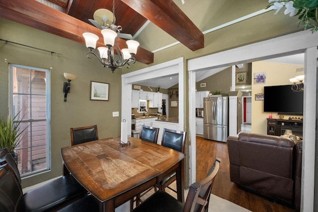 dining area with an inviting chandelier, vaulted ceiling with beams, and wood finished floors