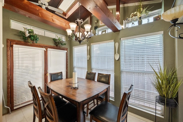 dining space featuring an inviting chandelier and light tile patterned floors