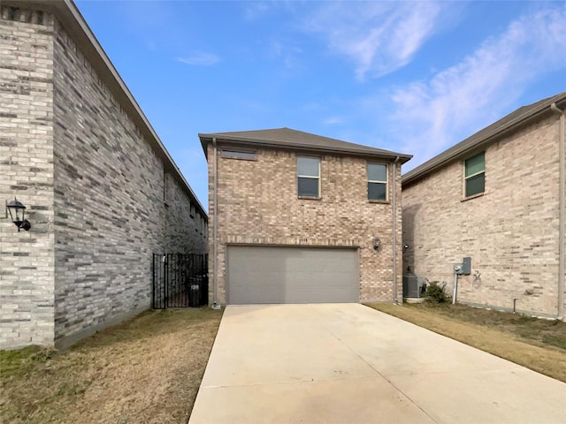 view of front of house featuring cooling unit, brick siding, concrete driveway, and an attached garage