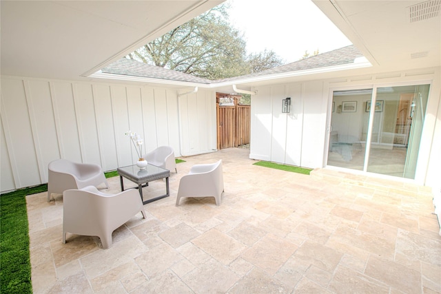 view of patio / terrace with visible vents and fence