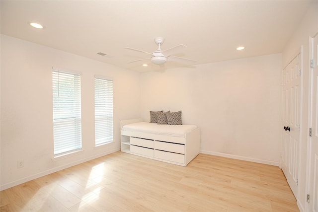 unfurnished bedroom with visible vents, baseboards, recessed lighting, ceiling fan, and light wood-type flooring