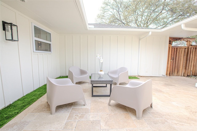 view of patio / terrace featuring fence