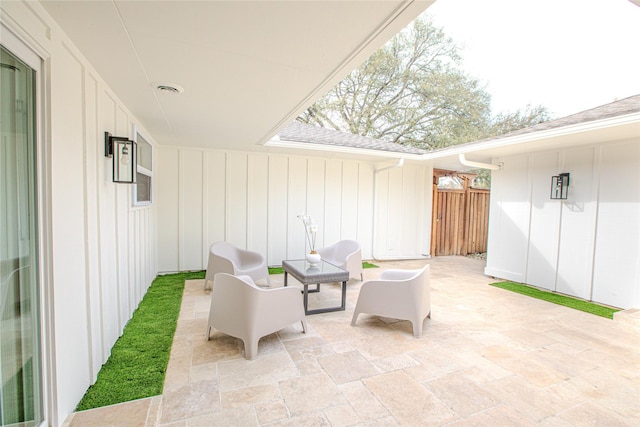 view of patio / terrace featuring fence