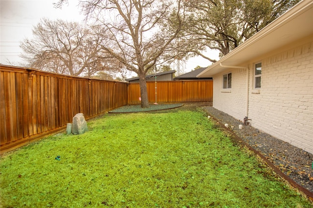 view of yard with a fenced backyard