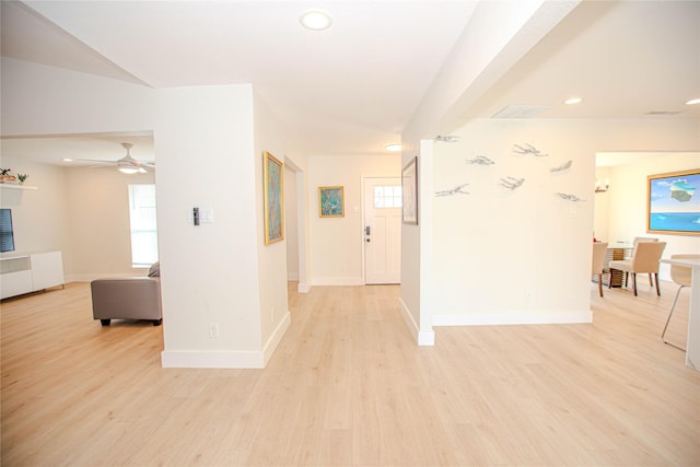 foyer with recessed lighting, light wood-style flooring, and baseboards