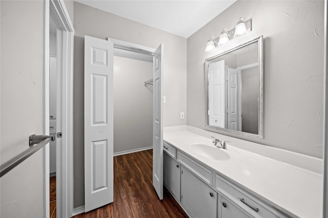 bathroom featuring wood finished floors and vanity