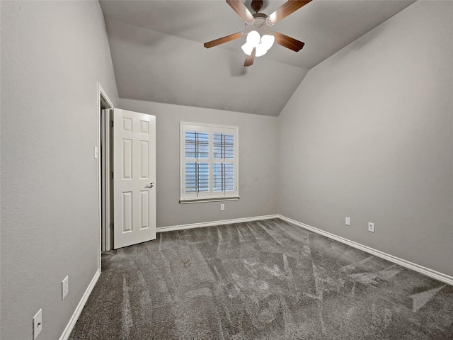 unfurnished bedroom featuring ceiling fan, baseboards, carpet, and lofted ceiling