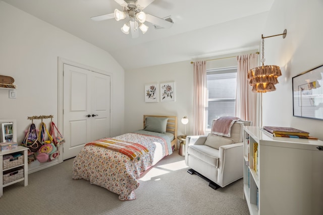 bedroom featuring vaulted ceiling, carpet flooring, a closet, and ceiling fan