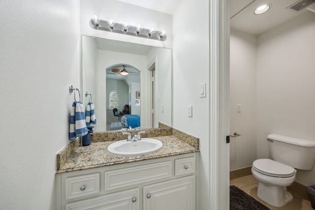 bathroom featuring tile patterned floors, visible vents, toilet, ensuite bath, and vanity