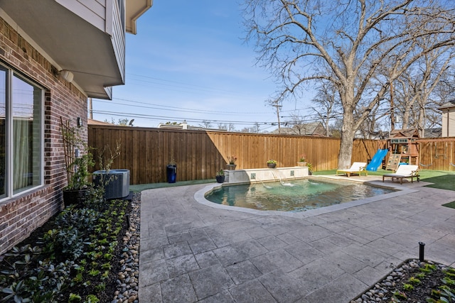 view of pool featuring a patio, central AC unit, a fenced in pool, a fenced backyard, and a playground