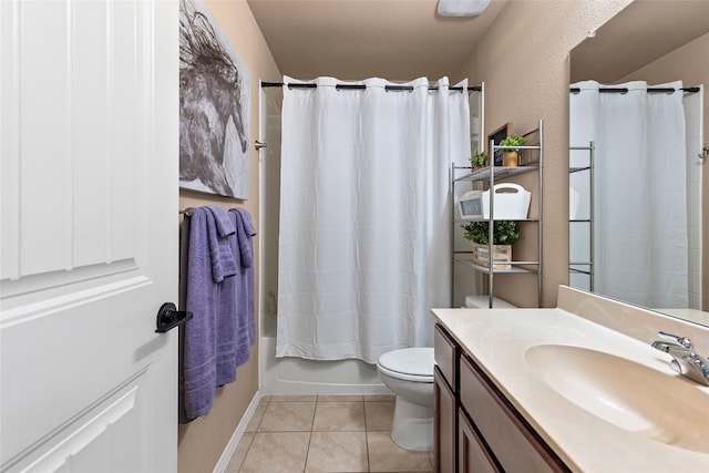 bathroom with tile patterned flooring, toilet, vanity, and shower / bath combo