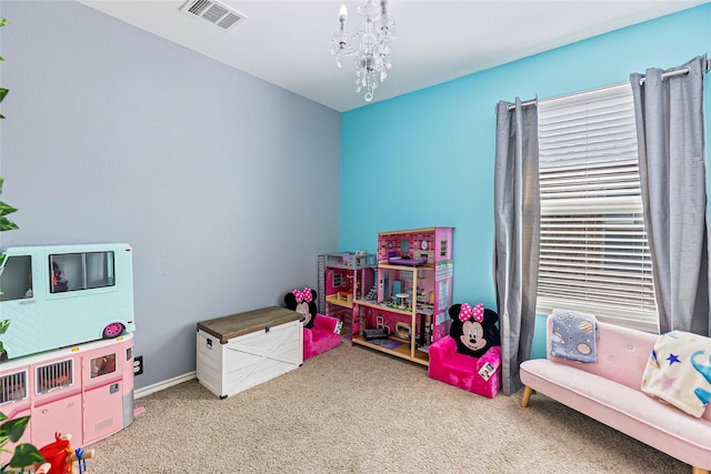 rec room with visible vents, a chandelier, and carpet flooring