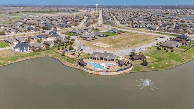 aerial view with a residential view and a water view