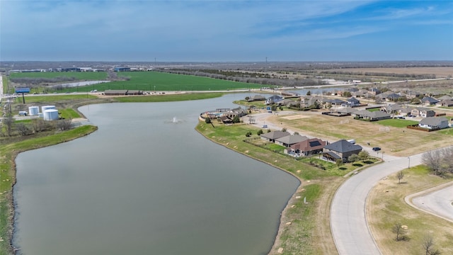 bird's eye view with a residential view and a water view