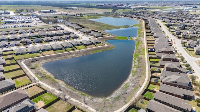 bird's eye view featuring a residential view and a water view