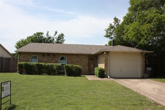 ranch-style home with brick siding, driveway, an attached garage, and a front lawn