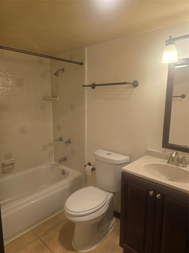 full bath featuring tile patterned floors, toilet, vanity, and  shower combination