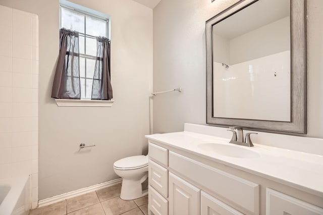 bathroom with vanity, baseboards, bathtub / shower combination, tile patterned floors, and toilet